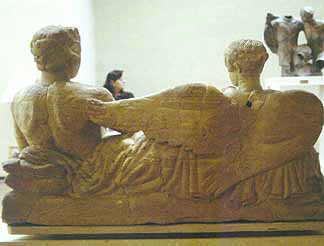 Banqueter and Vanth, Limestone Cinerary Urn, back view.